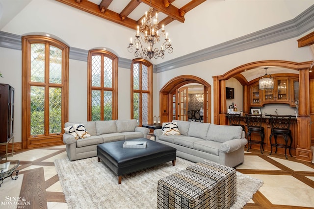 tiled living room with bar, a towering ceiling, a wealth of natural light, and an inviting chandelier