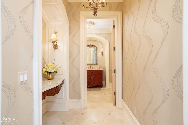 hall with crown molding and sink