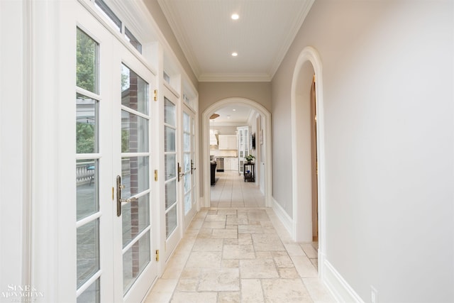 corridor featuring french doors and ornamental molding