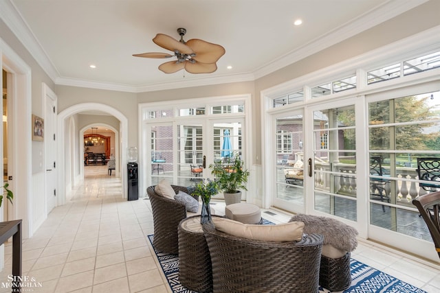 sunroom featuring a wealth of natural light and ceiling fan