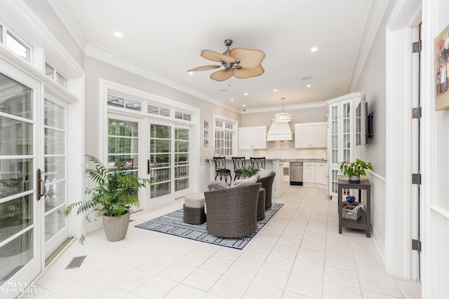 sunroom / solarium with french doors and ceiling fan