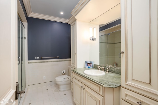 bathroom featuring ornamental molding, vanity, tile walls, tile patterned flooring, and toilet