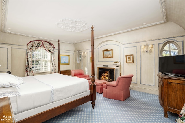 carpeted bedroom featuring ornamental molding