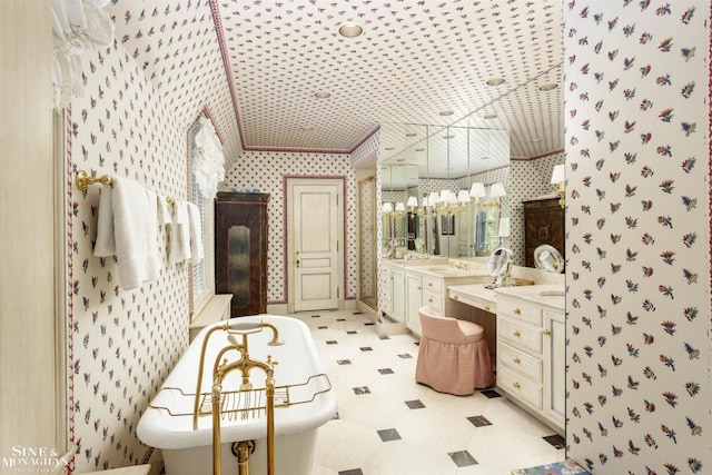 bathroom featuring a bathtub, vanity, and ornamental molding