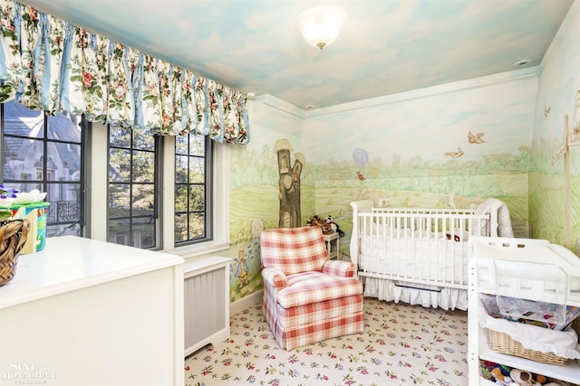 bedroom with radiator heating unit and crown molding