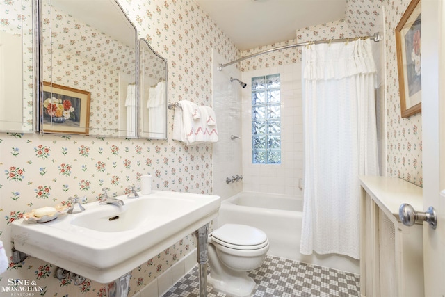 full bathroom with sink, tile patterned flooring, shower / bath combination with curtain, and toilet