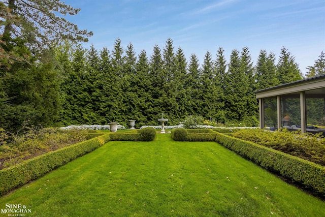 view of yard with a sunroom