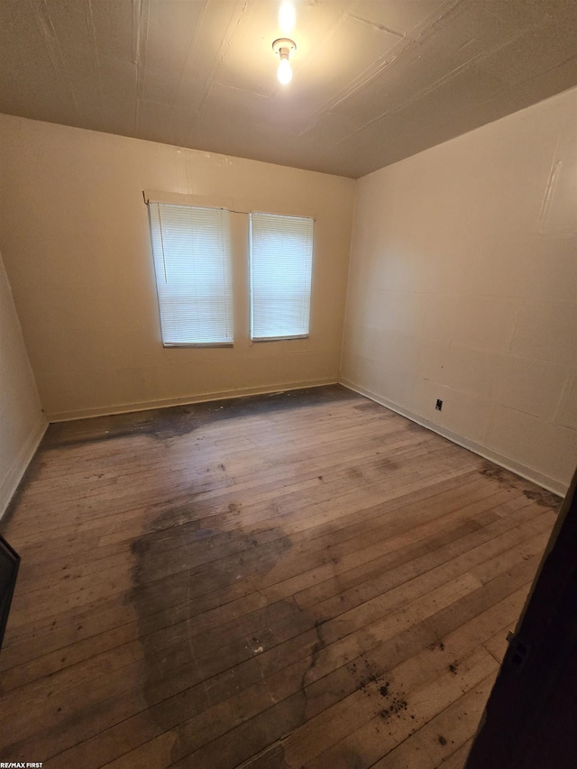 unfurnished room featuring hardwood / wood-style floors