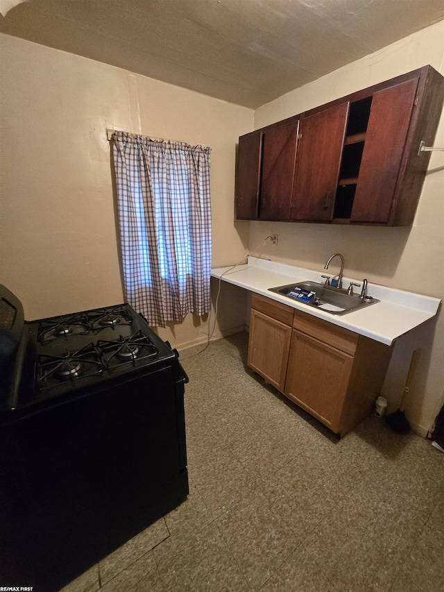 kitchen with black range oven and sink