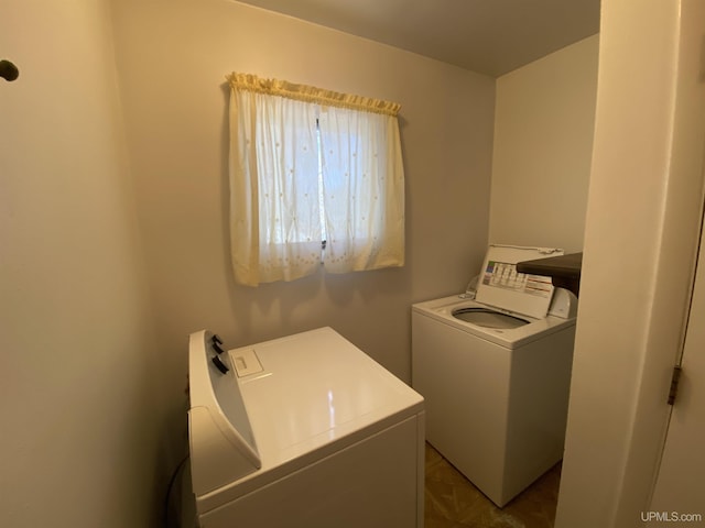 washroom with washing machine and dryer