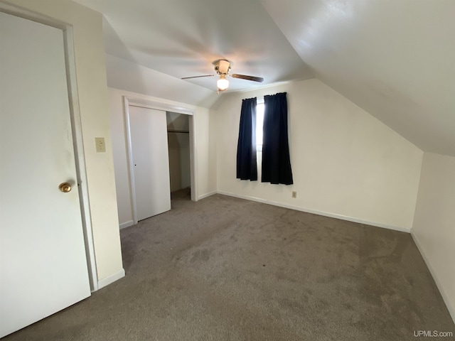 bonus room with carpet flooring, ceiling fan, and vaulted ceiling