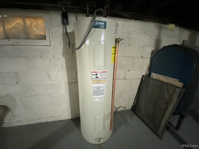 utility room with electric water heater