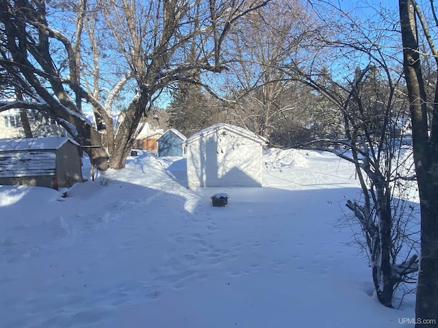 view of yard covered in snow