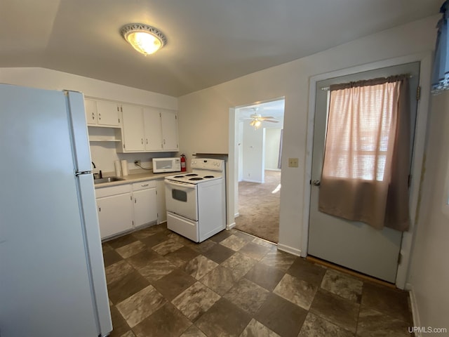 kitchen featuring white appliances, white cabinetry, ceiling fan, and sink