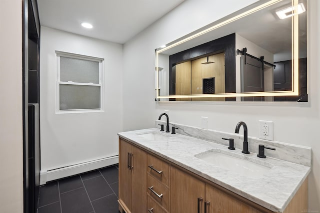 bathroom with tile patterned floors, vanity, and a baseboard heating unit