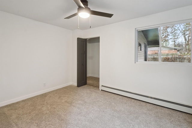 unfurnished bedroom with ceiling fan, light colored carpet, and baseboard heating