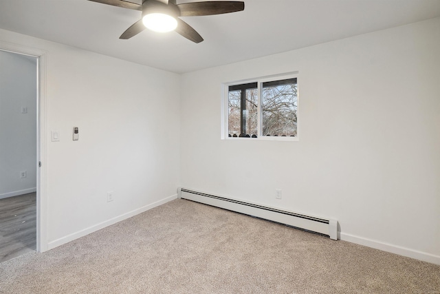 unfurnished room featuring ceiling fan, light colored carpet, and a baseboard heating unit