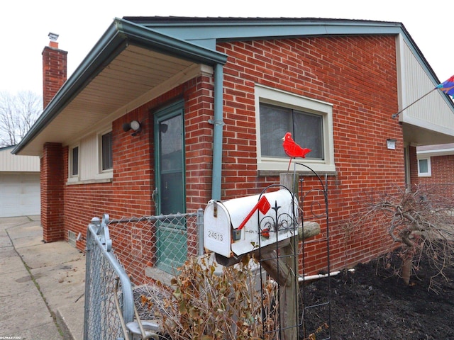 view of home's exterior with an outbuilding and a garage