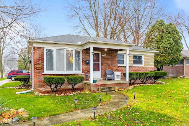 bungalow-style house with a front yard