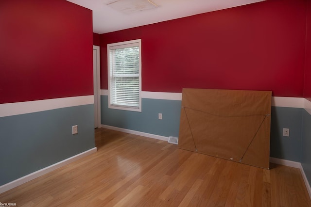 empty room with light wood-type flooring