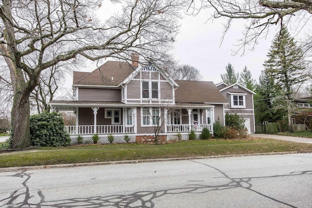 view of front facade with a porch and a front yard