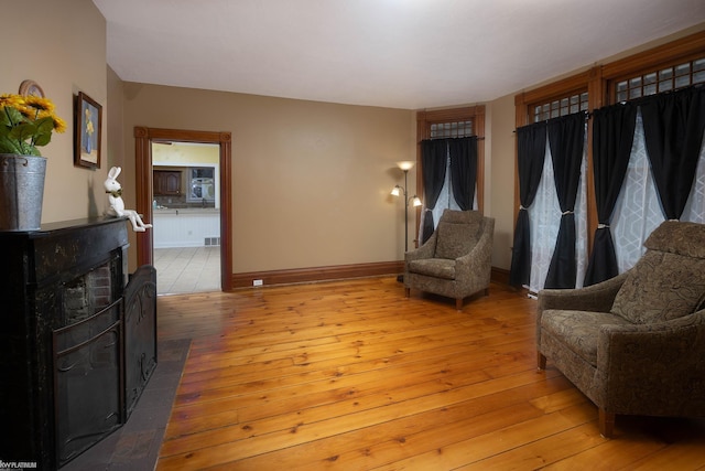 living area with light hardwood / wood-style flooring