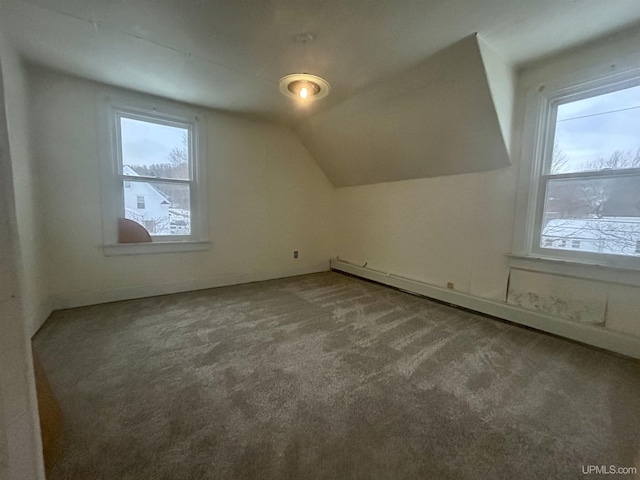 bonus room featuring carpet flooring, lofted ceiling, and a baseboard heating unit