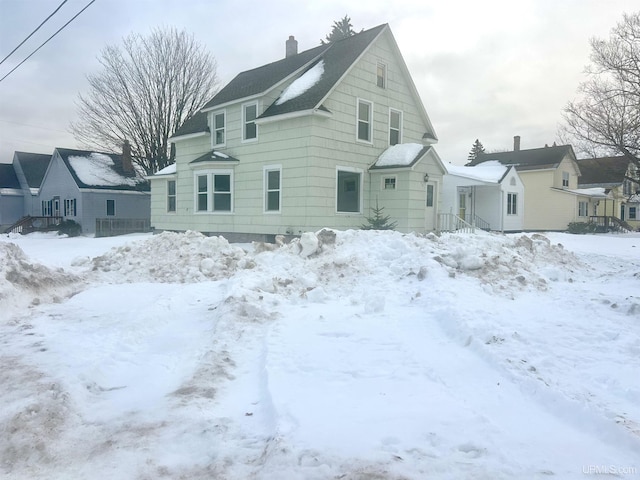 view of snow covered house