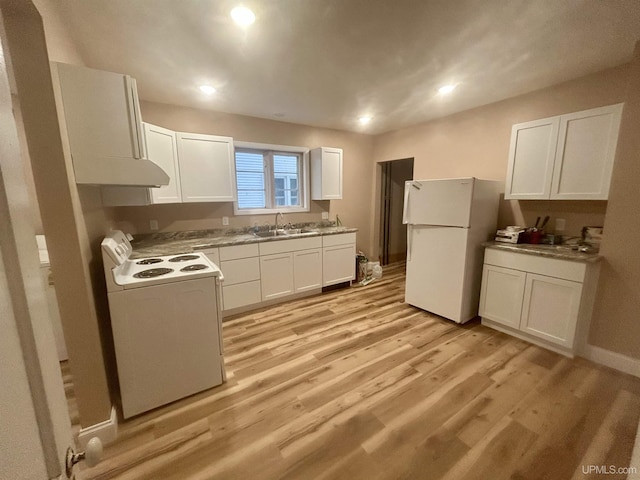 301 E Chocolay St, Munising, MI 49862 - kitchen featuring white appliances, extractor fan, white cabinetry, light wood finished floors, and light countertops