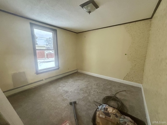 carpeted spare room featuring a textured ceiling and a baseboard radiator