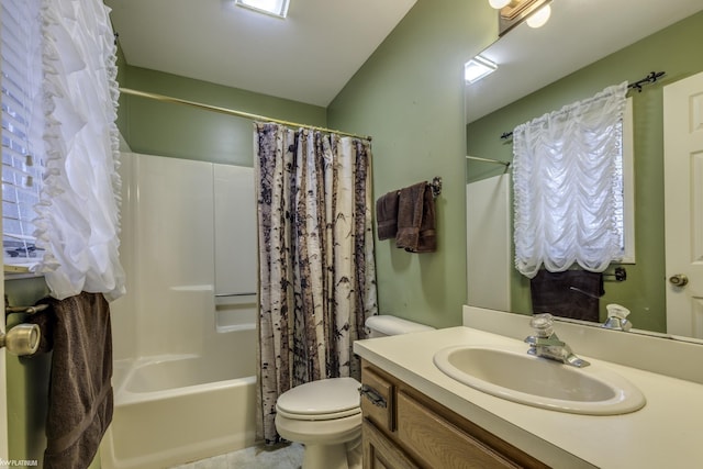 full bathroom with vanity, shower / bath combo, and toilet