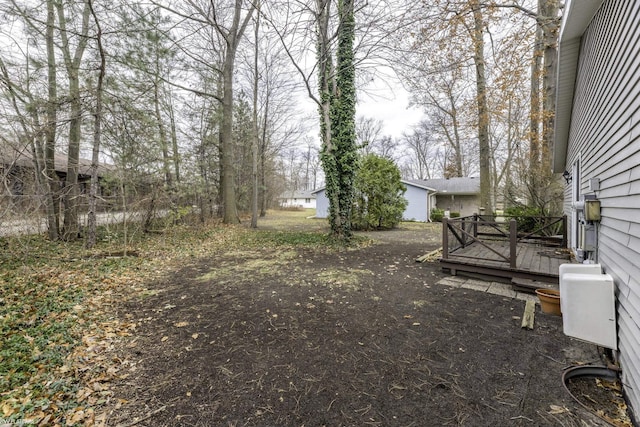 view of yard with a wooden deck