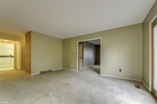 unfurnished bedroom with ensuite bathroom and light colored carpet