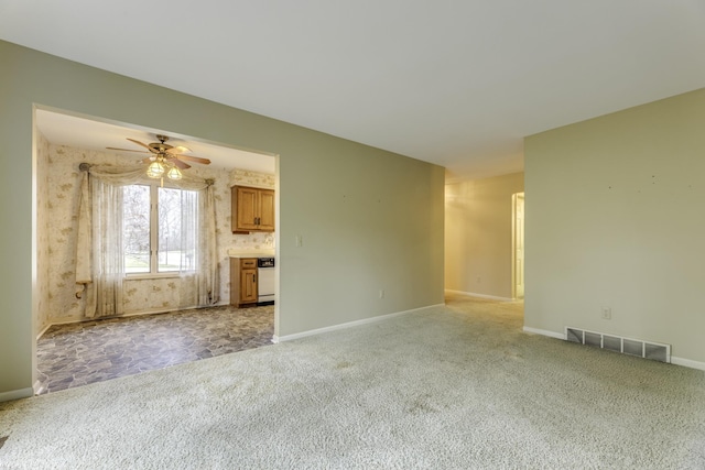 unfurnished living room featuring ceiling fan and light carpet