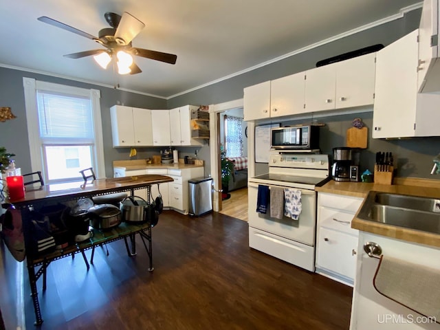 kitchen featuring white cabinetry, crown molding, white electric stove, and sink