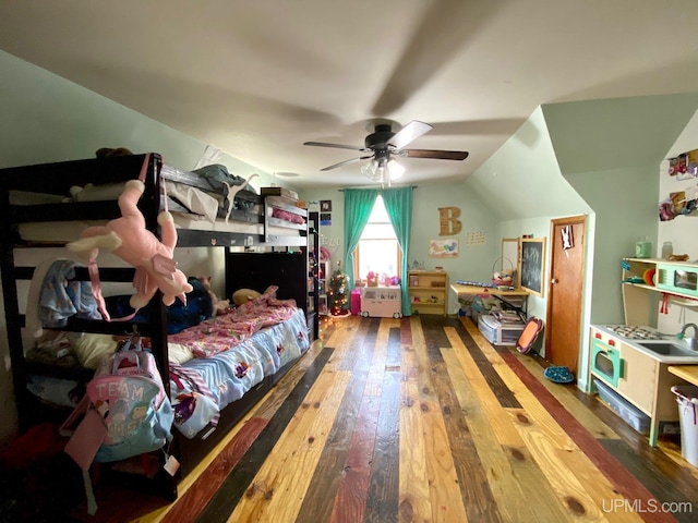 bedroom with ceiling fan, wood-type flooring, and lofted ceiling