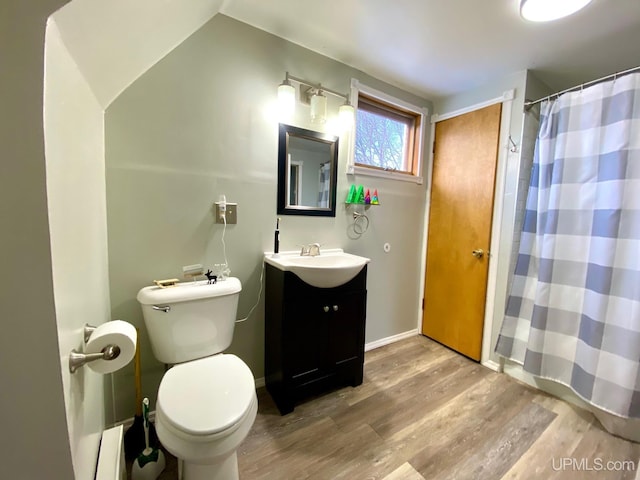 bathroom with baseboard heating, wood-type flooring, vanity, toilet, and a shower with shower curtain