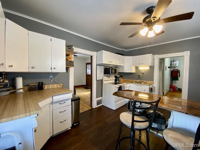 kitchen featuring white cabinetry, ceiling fan, white electric range oven, dark wood-type flooring, and ornamental molding