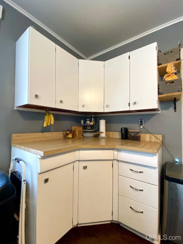 kitchen with white cabinets and crown molding