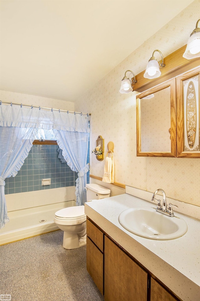 bathroom with curtained shower, vanity, and toilet