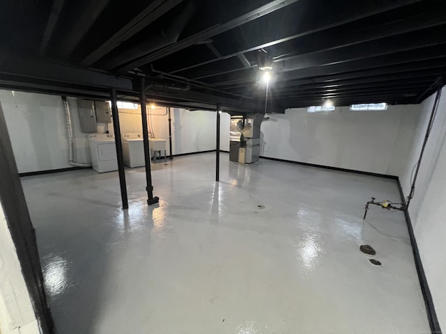 basement featuring sink and independent washer and dryer