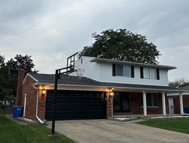 view of front of property with a porch and a garage