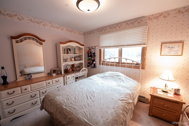 carpeted bedroom with a baseboard radiator