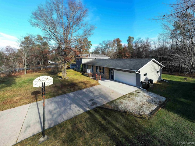 single story home featuring a garage and a front lawn