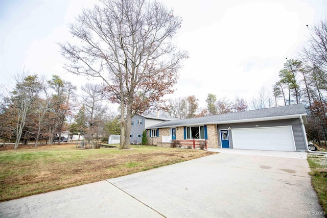 ranch-style home featuring a garage and a front lawn