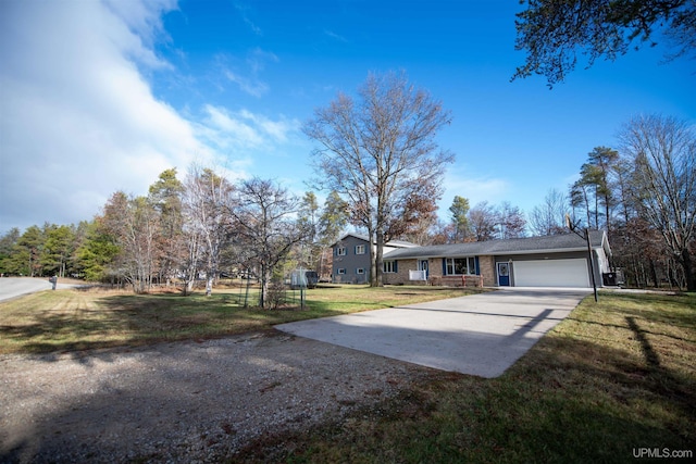 ranch-style home with a front yard and a garage