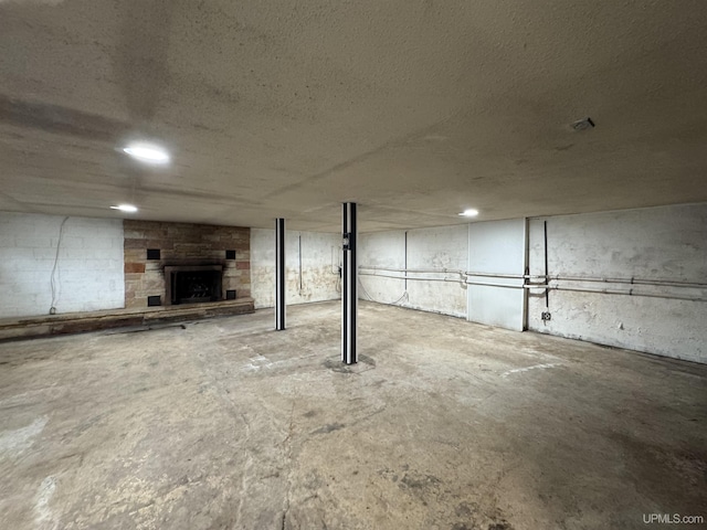 basement with a fireplace