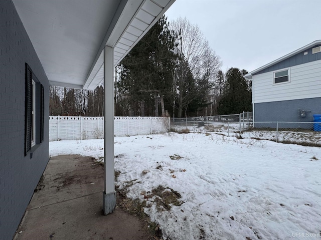 view of yard covered in snow