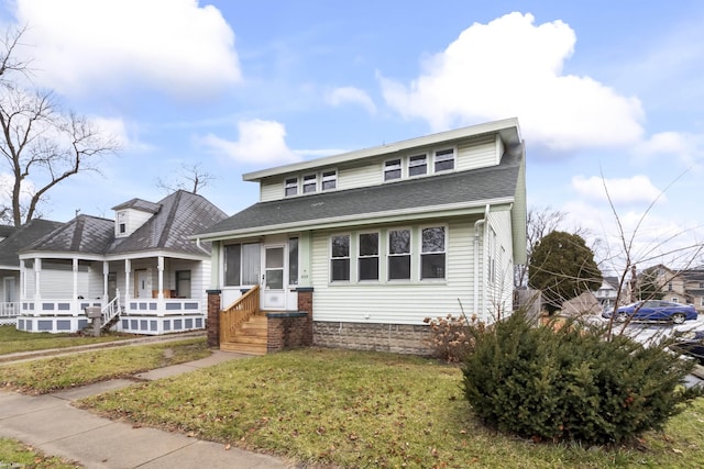 view of front of home featuring a front yard and covered porch