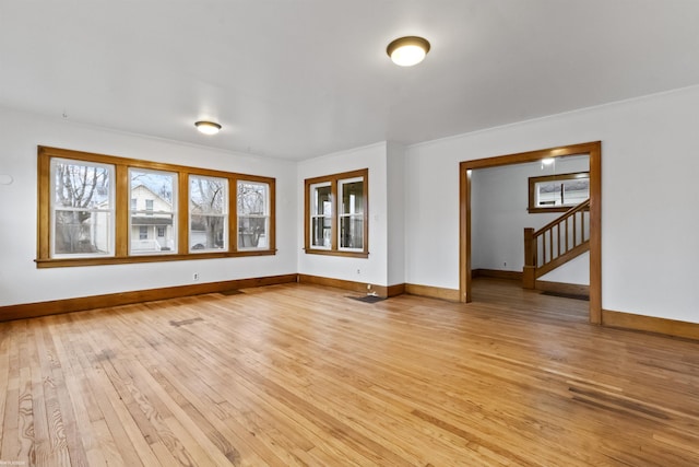 empty room with light hardwood / wood-style floors